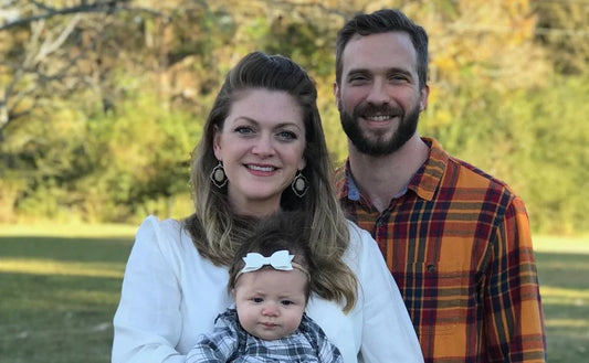 Parents holding baby