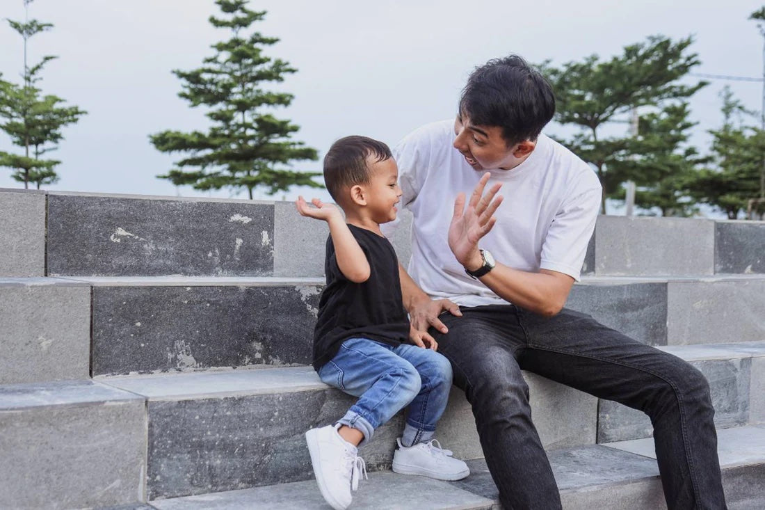 Father and son high-five
