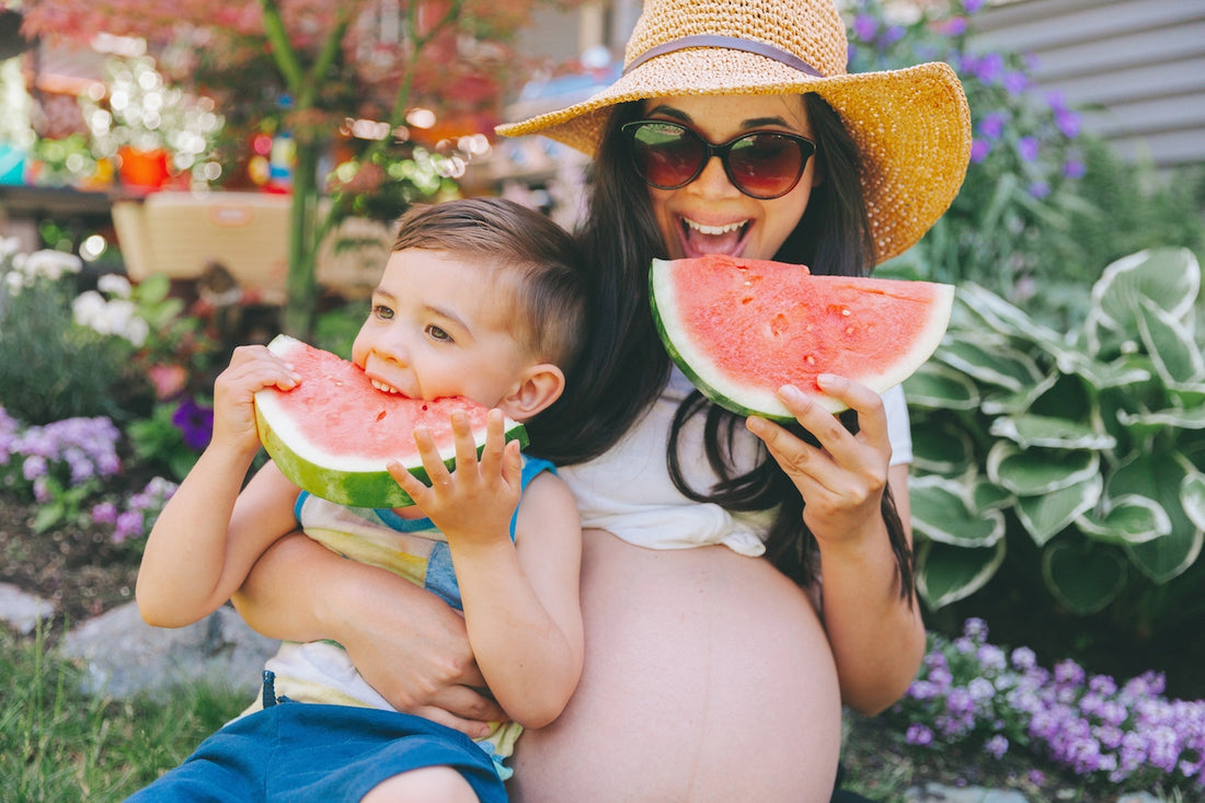 Mum and toddler eating hydrating foods
