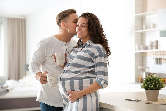 husband-kissing-pregnant-wife