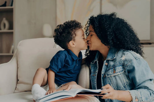 Mum kissing toddler son