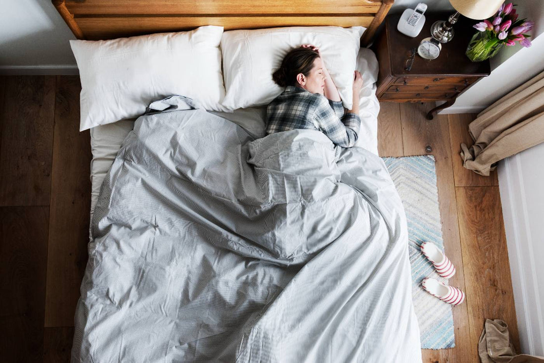sleep and mental health: woman sleeping in bed