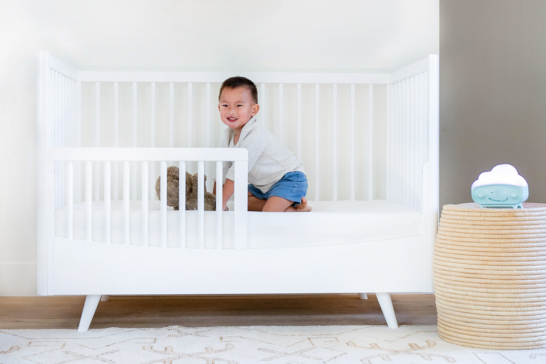 Toddler using SNOObie ok-to-wake alarm