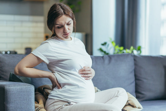 A pregnant woman looks in pain