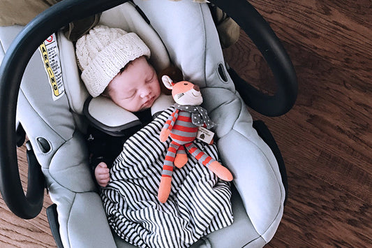 baby sleeping in car seat at night