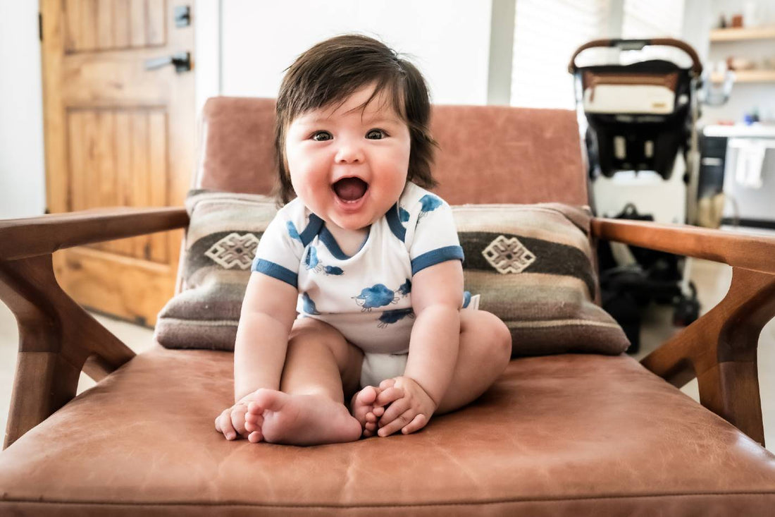 Smiling baby experiencing a growth spurt