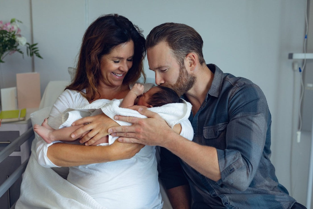 new-mom-and-dad-after-birth-with-newborn-baby-in-hospital
